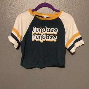 Dark green cropped shirt, with white sleeves